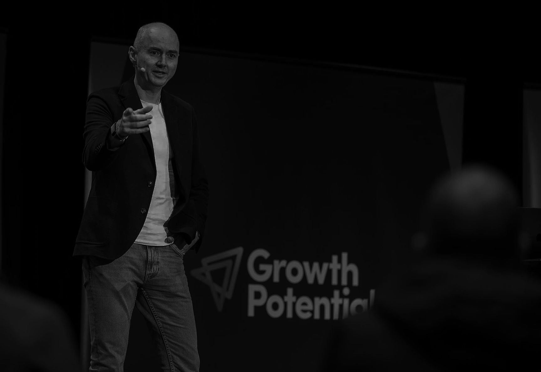 Speaker on stage at the Growth Potential Business Conference